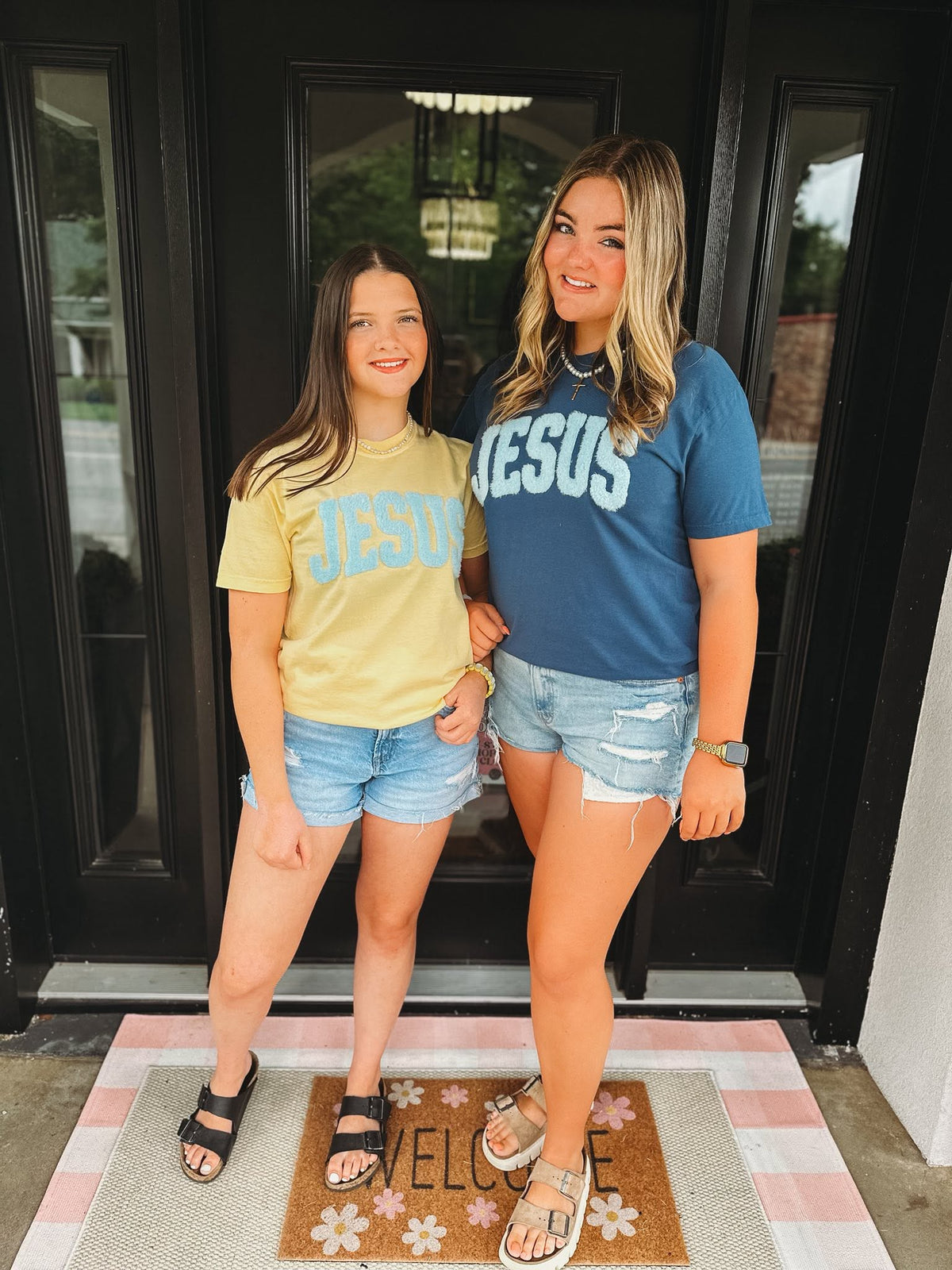 women wearing Jesus comfort colors christian t-shirts with blue chenille patch in butter and midnight