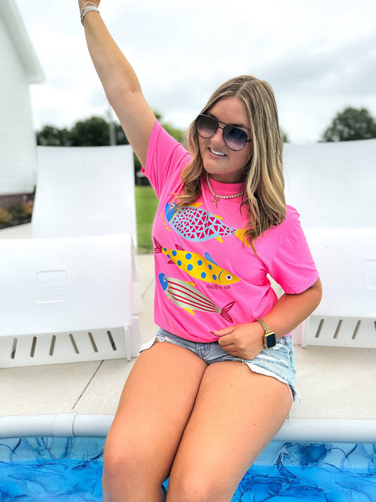 woman wearing neon pink fisher of men christian shirt inspired by matthew 4:19